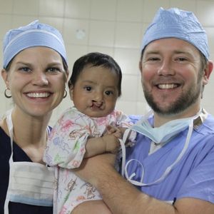 Ann Brown and Dr. Brown with child pre-surgery