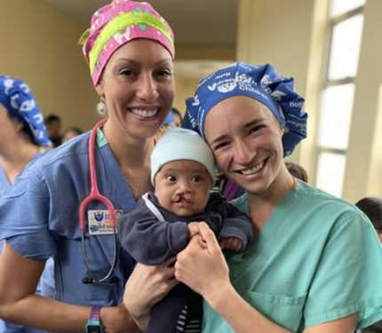 volunteers with baby pre-surgery