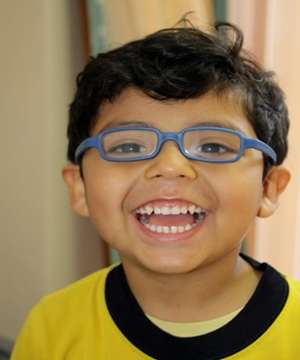 child wearing new glasses