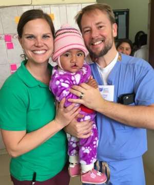 Ann and Dr. Brown with child pre-surgery