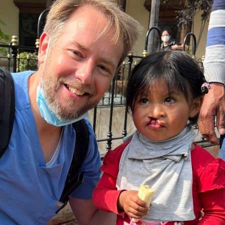 Dr Brown with child that needs surgery