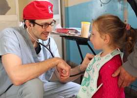 doctor speaking with child