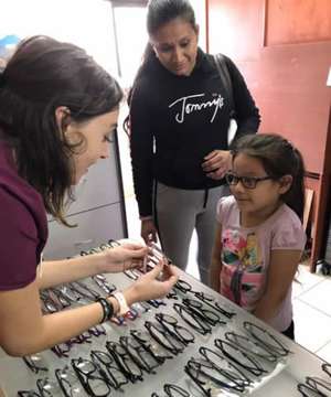 child choosing her new glass frames
